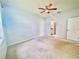 Spacious bedroom showcases neutral carpet and an en-suite bathroom for added privacy and convenience at 3461 Home Town Ln, St Cloud, FL 34769
