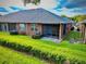 Well-maintained backyard with a screened-in porch and manicured lawn, perfect for outdoor relaxation at 3461 Home Town Ln, St Cloud, FL 34769