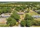Aerial view of a property surrounded by trees and lawns at 3975 Rambler Ave, St Cloud, FL 34772