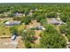 Aerial view of the property, showcasing its lush landscaping and spacious lot at 3975 Rambler Ave, St Cloud, FL 34772