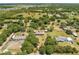An aerial view of a home and property surrounded by trees and nature at 3975 Rambler Ave, St Cloud, FL 34772