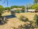 Aerial view of backyard featuring mature landscaping with metal carport at 3975 Rambler Ave, St Cloud, FL 34772