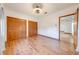 Bright bedroom featuring hardwood floors, closet and entry to the rest of the house at 3975 Rambler Ave, St Cloud, FL 34772