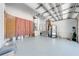 Spacious garage with utility appliances and stairs to entryway at 3975 Rambler Ave, St Cloud, FL 34772
