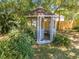 An ornate gazebo provides an outdoor retreat with seating in a garden setting at 3975 Rambler Ave, St Cloud, FL 34772
