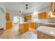 Spacious kitchen featuring a kitchen island, light wood cabinetry, and stainless steel appliances at 3975 Rambler Ave, St Cloud, FL 34772