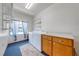 Functional laundry room with a washer, dryer, storage cabinets, and natural light from a window at 3975 Rambler Ave, St Cloud, FL 34772