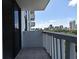 Balcony view of the city skyline with tile floors and a railing for relaxing outdoor enjoyment at 400 E Colonial Dr # 1003, Orlando, FL 32803