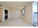Bright bedroom featuring tile flooring, built-in desk, and city views from the window at 400 E Colonial Dr # 1003, Orlando, FL 32803