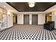Well-lit elevator lobby featuring modern lighting, neutral decor, and geometric patterned flooring at 400 E Colonial Dr # 1003, Orlando, FL 32803