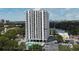 Modern condo building featuring a swimming pool and ample parking at 400 E Colonial Dr # 1003, Orlando, FL 32803
