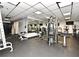Fully equipped gym area with weight and cardio machines, rubber flooring and mirrors at 400 E Colonial Dr # 1003, Orlando, FL 32803