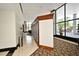 Hallway with large windows, decorative doors, and stylish carpeting creates an inviting atmosphere at 400 E Colonial Dr # 1003, Orlando, FL 32803