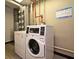Laundry room with commercial-grade washer and dryer for residents' convenience at 400 E Colonial Dr # 1003, Orlando, FL 32803