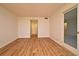 A bright living room featuring modern wood-look flooring and neutral walls at 400 E Colonial Dr # 1003, Orlando, FL 32803