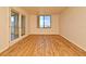 A bright living room featuring modern wood-look flooring and a city view at 400 E Colonial Dr # 1003, Orlando, FL 32803