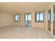 Bright and airy living room with tile floors and access to the balcony at 400 E Colonial Dr # 1003, Orlando, FL 32803