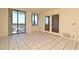 Spacious living room featuring tile flooring, balcony access, and ample natural light at 400 E Colonial Dr # 1003, Orlando, FL 32803