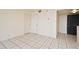 A living area is enhanced by tiled floors and neutral tones at 400 E Colonial Dr # 1003, Orlando, FL 32803