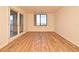 A bright living room featuring modern wood-look flooring and a city view at 400 E Colonial Dr # 1003, Orlando, FL 32803