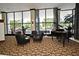 Lobby area with multiple chairs and grand piano at 400 E Colonial Dr # 1003, Orlando, FL 32803