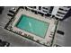 Aerial view of the community pool area with lounge chairs and the Park Lake Towers building at 400 E Colonial Dr # 1003, Orlando, FL 32803