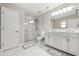 Bathroom with double sink vanity, tiled walk-in shower and linen closet at 429 Rona Ln, Davenport, FL 33897