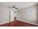 Bedroom with wood floor, walk-in closet, and natural light from a window at 429 Rona Ln, Davenport, FL 33897
