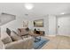 Inviting living room features neutral tones, a large TV, and a cozy blue area rug at 429 Rona Ln, Davenport, FL 33897