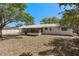 Spacious backyard with a screened-in patio offers an outdoor space for relaxation at 5326 Weirwood Ave, Orlando, FL 32810