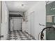 Unfinished basement with storage, water heater, and checkerboard floors at 5326 Weirwood Ave, Orlando, FL 32810