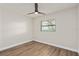 Bedroom features a modern ceiling fan, hardwood floors, and a window providing natural light at 5326 Weirwood Ave, Orlando, FL 32810