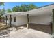 Spacious carport featuring a well-lit covered parking area and ample space at 5326 Weirwood Ave, Orlando, FL 32810