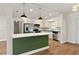 Eat-in kitchen featuring stainless steel appliances, dark countertops, and a bright white backsplash at 5326 Weirwood Ave, Orlando, FL 32810