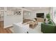Tastefully furnished living area with a green sofa and comfortable seating at 5326 Weirwood Ave, Orlando, FL 32810