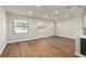 Spacious living room area with two windows providing lots of natural light at 5326 Weirwood Ave, Orlando, FL 32810