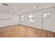 Bright living area with hardwood flooring and a view of the front yard at 5326 Weirwood Ave, Orlando, FL 32810