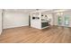 Open floorplan with stylish flooring connecting the living and kitchen spaces at 5326 Weirwood Ave, Orlando, FL 32810