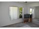 Bright bedroom featuring a window with vertical blinds and a mirrored closet at 5502 Minaret Ct, Orlando, FL 32821