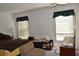 Spacious bedroom featuring natural light, a ceiling fan, and dark window treatments at 5502 Minaret Ct, Orlando, FL 32821