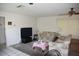 Spacious living room with comfortable floral sofas, neutral carpet, and a ceiling fan at 5502 Minaret Ct, Orlando, FL 32821
