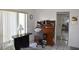 Bright office space with a roll-top desk, white tile floors, and a large window at 5502 Minaret Ct, Orlando, FL 32821