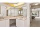 Bathroom vanity with double sinks, tile floor and direct access to the main bedroom suite at 58 Golf View Dr, Ocala, FL 34472