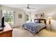 Cozy bedroom with two large windows and neutral decor at 58 Golf View Dr, Ocala, FL 34472