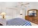 Comfortable bedroom featuring carpeted floors and ample closet space at 58 Golf View Dr, Ocala, FL 34472