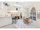 Bright breakfast nook with a tile floor, counter seating, and arched window at 58 Golf View Dr, Ocala, FL 34472
