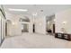 Spacious living room featuring an open floor plan, high ceilings, and natural light at 58 Golf View Dr, Ocala, FL 34472