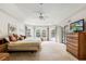 Spacious main bedroom with large windows, carpet, and natural light at 58 Golf View Dr, Ocala, FL 34472