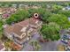 Aerial view of townhomes surrounded by mature trees in a well-maintained neighborhood at 6147 Sunnyvale Dr # Ge, Orlando, FL 32822