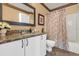 Bathroom featuring granite countertop, cabinets, and a mirror, complete with a shower and toilet at 6147 Sunnyvale Dr # Ge, Orlando, FL 32822